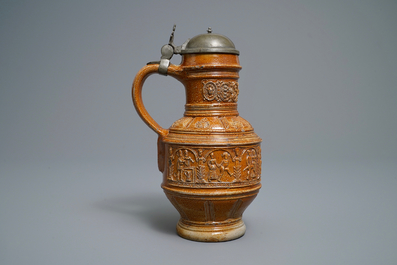 A 'Peasants dance' stoneware jug with pewter lid, Raeren, dated 1578