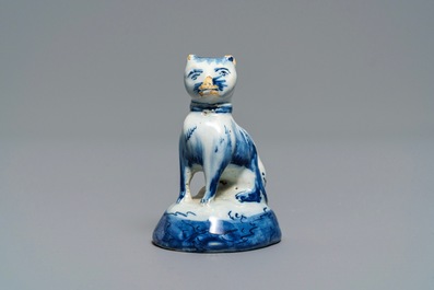 A Dutch Delft blue and white miniature model of a cat, 18th C.