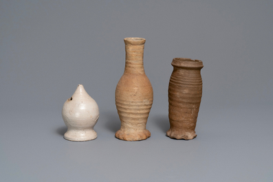 Two early German stoneware jugs and a money bank, 14/15th C. and later