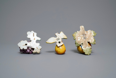 Seven polychrome Dutch Delft models of apples, grapes and pears, 18th C.