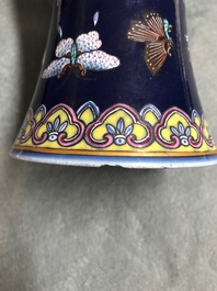 A Chinese blue-ground bottle vase with overglaze butterfly design, Guangxu mark, 19/20th C.