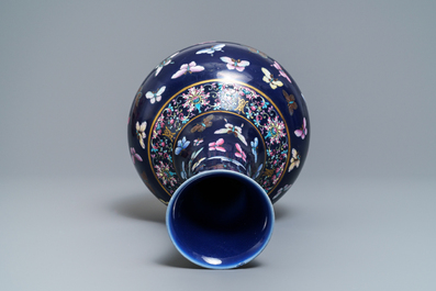 A Chinese blue-ground bottle vase with overglaze butterfly design, Guangxu mark, 19/20th C.