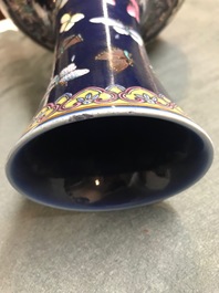 A Chinese blue-ground bottle vase with overglaze butterfly design, Guangxu mark, 19/20th C.