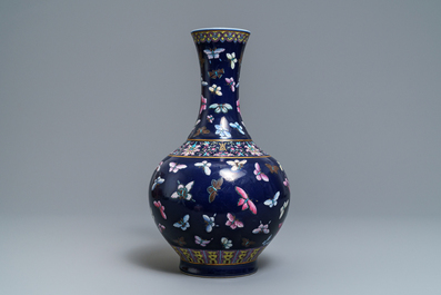 A Chinese blue-ground bottle vase with overglaze butterfly design, Guangxu mark, 19/20th C.