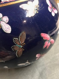 A Chinese blue-ground bottle vase with overglaze butterfly design, Guangxu mark, 19/20th C.