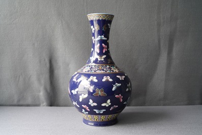 A Chinese blue-ground bottle vase with overglaze butterfly design, Guangxu mark, 19/20th C.