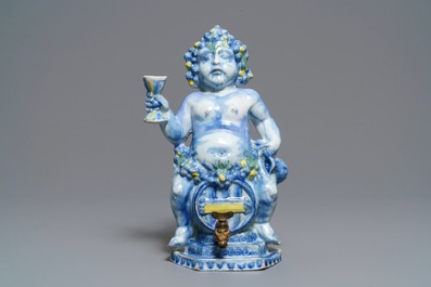 A polychrome Brussels faience 'Bacchus on a wine barrel' table fountain, 18th C.