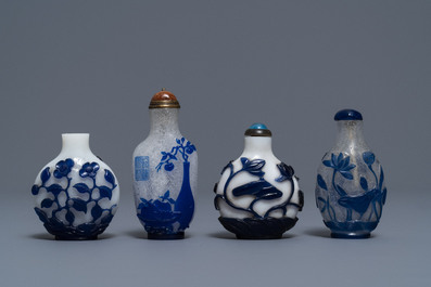 Nine various Chinese blue overlay and transparent glass snuff bottles, 19/20th C.