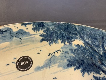 A very fine Dutch Delft blue and white dish with fighting horseriders, 18th C.