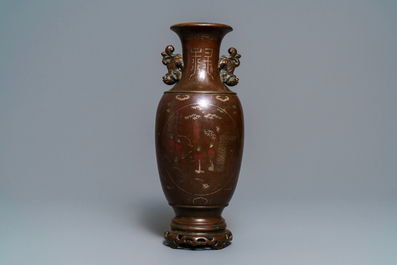 A Chinese or Vietnamese silver-inlaid and inscribed bronze vase, 19th C.