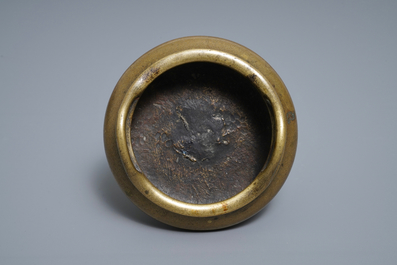 A Chinese bronze tripod incense burner, Xuande mark, 18/19th C.