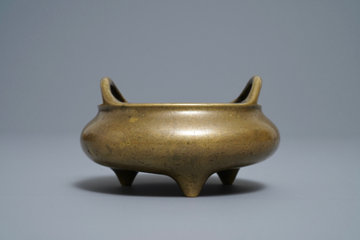 A Chinese bronze tripod incense burner, Xuande mark, 18/19th C.