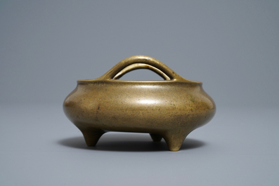 A Chinese bronze tripod incense burner, Xuande mark, 18/19th C.