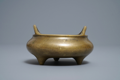 A Chinese bronze tripod incense burner, Xuande mark, 18/19th C.