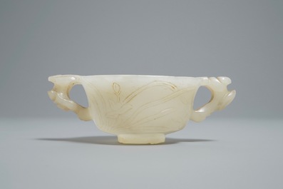 A Chinese pale celadon jade libation cup, 18/19th C.