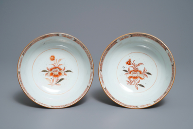 A pair of Chinese iron red bowls with a kiting boy on an ox, Yongzheng