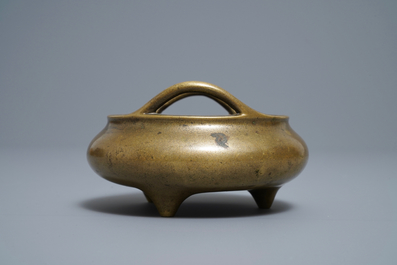 A Chinese bronze tripod incense burner, Xuande mark, 18/19th C.