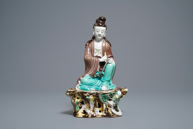 A Chinese verte biscuit figure of Buddha seated on a rock, seal mark, Republic