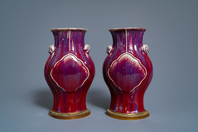 A pair of Chinese flamb&eacute;-glazed vases on gilt bronze stands, 18/19th C.