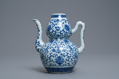 A Chinese blue and white 'bats and shou' jug, 19th C.