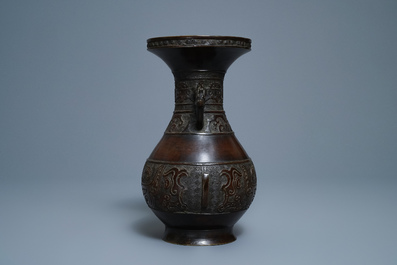 A Chinese archaic parcel-gilt bronze vase, Xuande mark, 18th C.