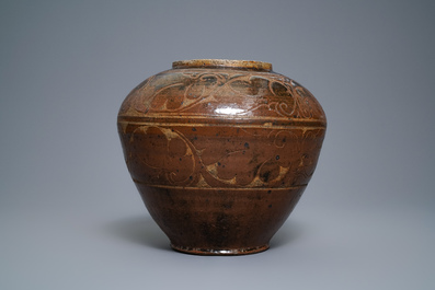 A Chinese brown-glazed cizhou jar with incised design, Yuan