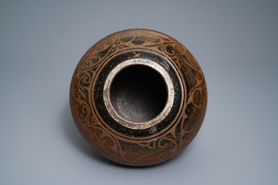 A Chinese brown-glazed cizhou jar with incised design, Yuan