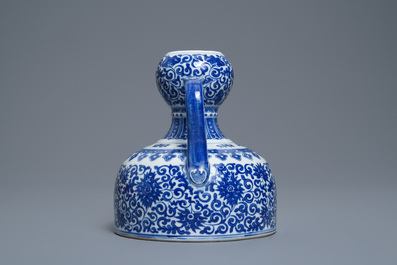 A Chinese blue and white two-handled 'lotus scroll' jug, Qianlong mark, 19/20th C.