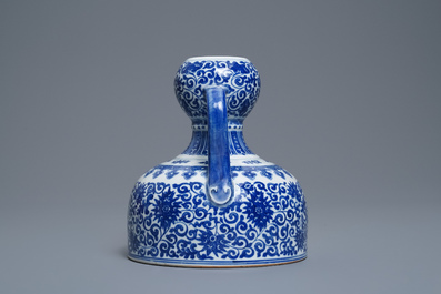 A Chinese blue and white two-handled 'lotus scroll' jug, Qianlong mark, 19/20th C.