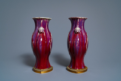A pair of Chinese flamb&eacute;-glazed vases on gilt bronze stands, 18/19th C.