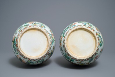 A pair of Chinese Canton famille verte vases with dragon handles, 19th C.