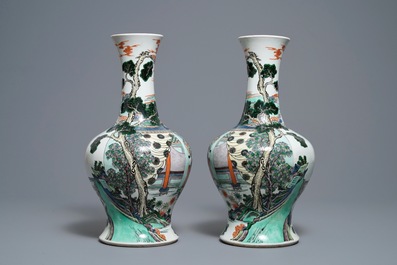 A pair of Chinese famille verte vases with figures on a terrace, Kangxi mark, 19th C.