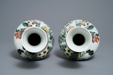 A pair of Chinese famille verte vases with figures on a terrace, Kangxi mark, 19th C.