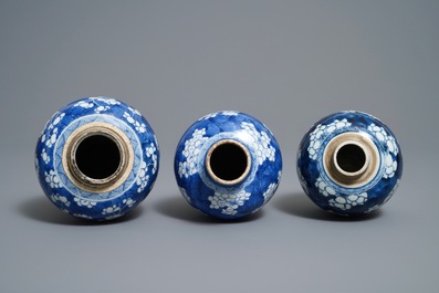 Three Chinese blue and white 'prunus on cracked ice' vases, Kangxi