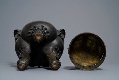 A large Chinese bronze incense burner and cover on carved wooden stand, Ming