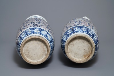 A pair of large Chinese blue, white and underglaze red vases, 19th C.