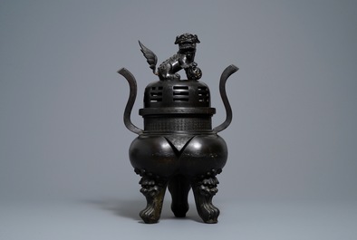 A large Chinese bronze incense burner and cover on carved wooden stand, Ming