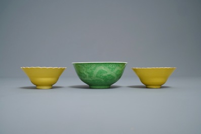 A pair of Chinese monochrome yellow bowls and a lime-green dragon bowl, Guangxu marks, 19/20th C.