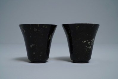 A pair of Chinese dark green jade wine cups, Qing