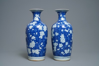 A pair of Chinese blue and white 'prunus on cracked ice' vases, 19th C.