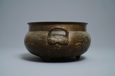 A large Chinese bronze tripod censer with engraved dragons, 19th C.