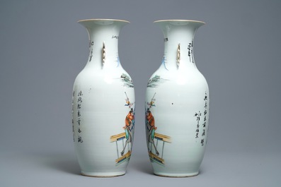 A pair of Chinese famille rose vases with travellers on a donkey, 19/20th C.