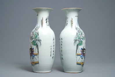 A pair of Chinese famille rose vases with travellers on a donkey, 19/20th C.