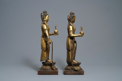 A pair of large Chinese gilt bronze figures, 19th C.