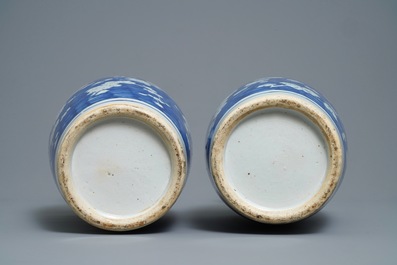 A pair of Chinese blue and white 'prunus on cracked ice' vases, 19th C.