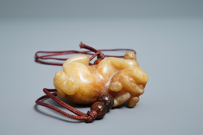 A Chinese jade 'twin fish' vase and a russet jade model of a dog, 19/20th C.