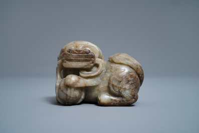 A Chinese pale grey-brown jade model of a Buddhist lion, 19/20th C.