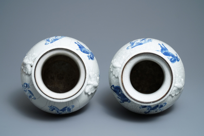 A pair of Chinese blue and white Nanking crackle-glazed vases with horses, 19th C.