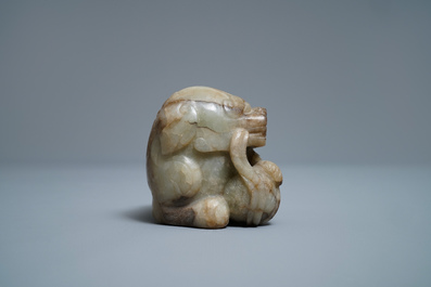 A Chinese pale grey-brown jade model of a Buddhist lion, 19/20th C.