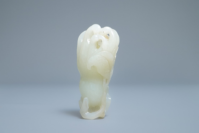 A Chinese celadon jade 'Buddha hand' carving, 19th C.